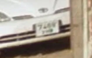 Zoomed in screenshot of a car's license plate in
7.png